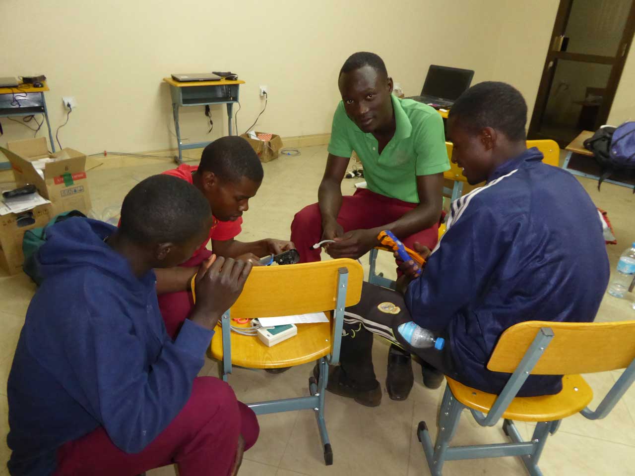 Student computer specialist team making network cables